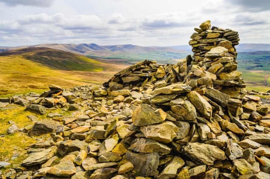 Summit cairn on Whinfell Beacon, looking towards Grayrigg Common and the Howgill Fells in the eastern Lake District